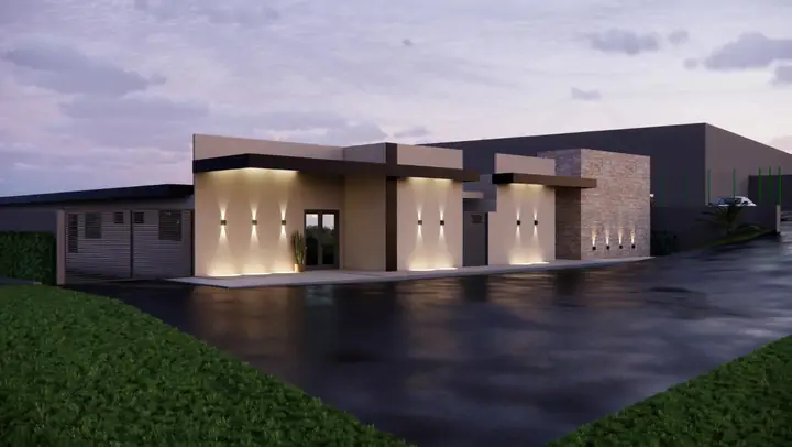 Projeto do Centro de Acolhida ao anoitecer, com a fachada iluminada por luminárias na parede.